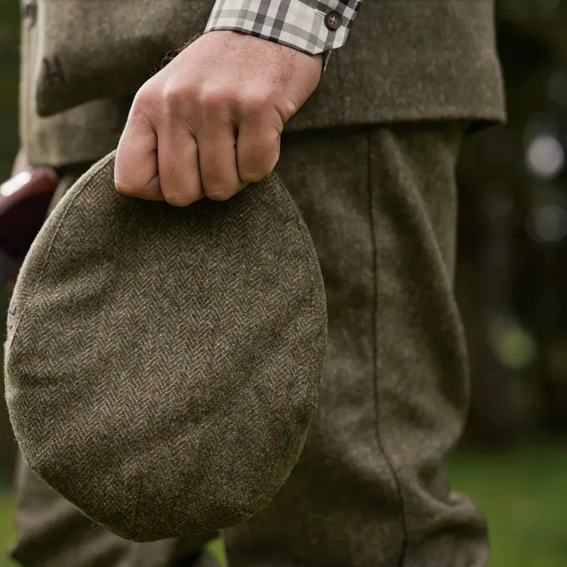 Härkila Kenmore CL. Tweed Flat Cap in Forest Green Herringbone-1